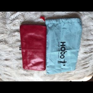 Red leather Hobo wallet with dust cover.